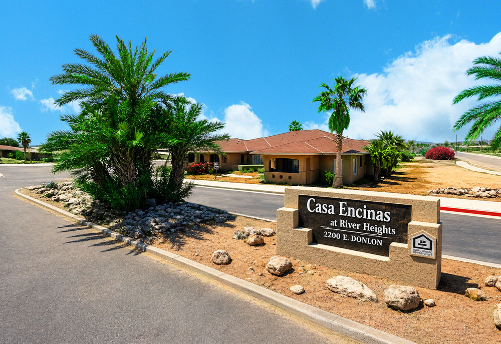 This image displays the exterior of Casa Encinas.